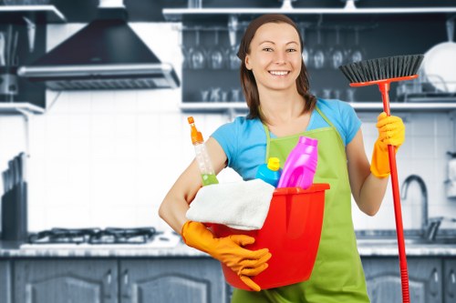 Cleaner washing exterior office windows with a squeegee