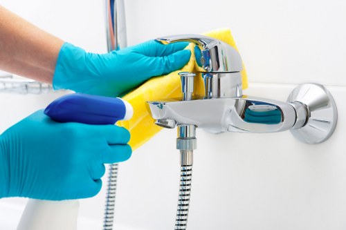 A Camden cleaning team working on detailed household surfaces